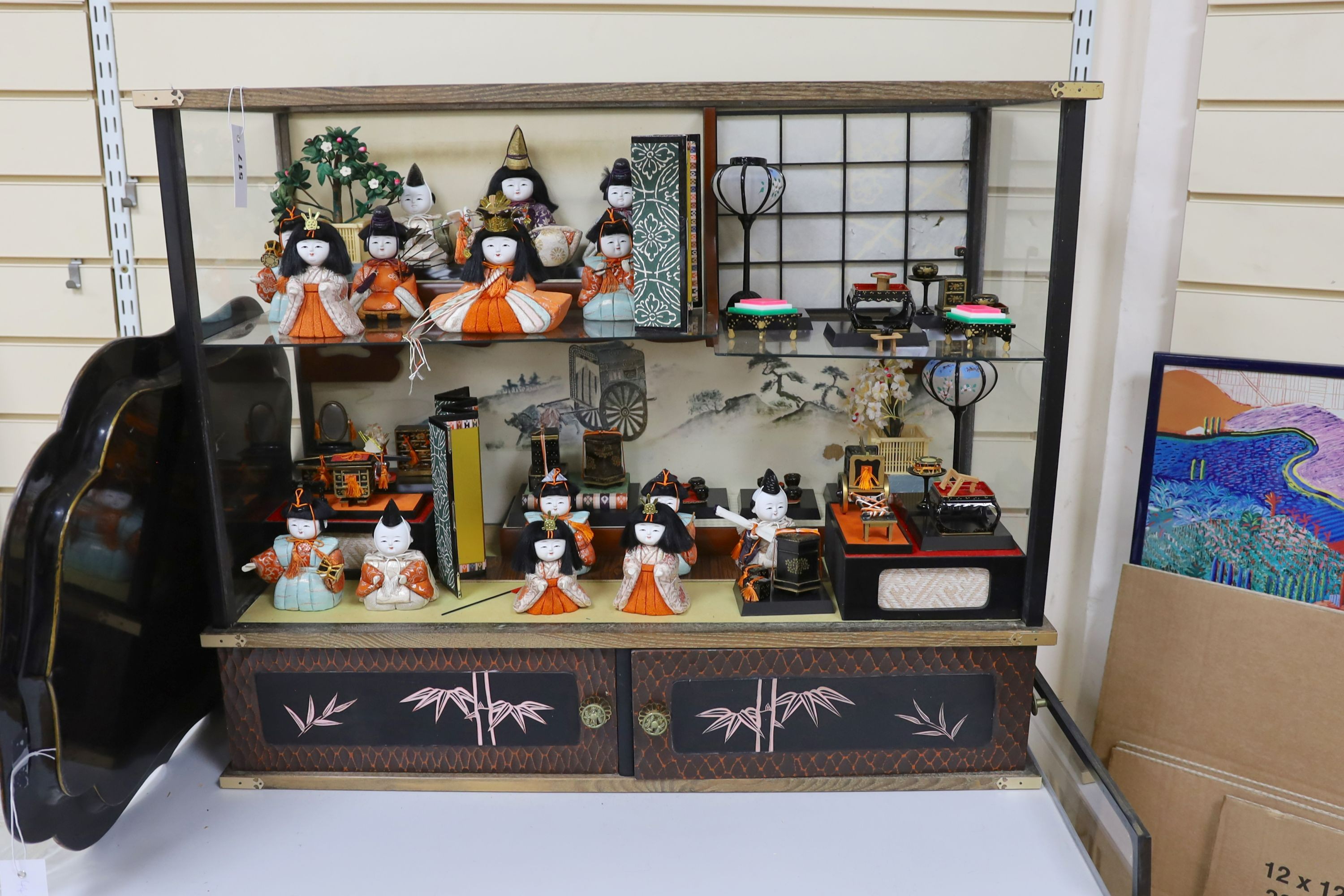 A 20th century Japanese diorama, (Hinamatsuri), depicting the Emperor's Court in an open cabinet, cabinet 84 cms wide x 69 cms high.